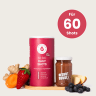 DAILY BERRY SHOTS: Rote Dose und Shotglas mit Beeren und Ingwer, Hinweis auf 60 Shots