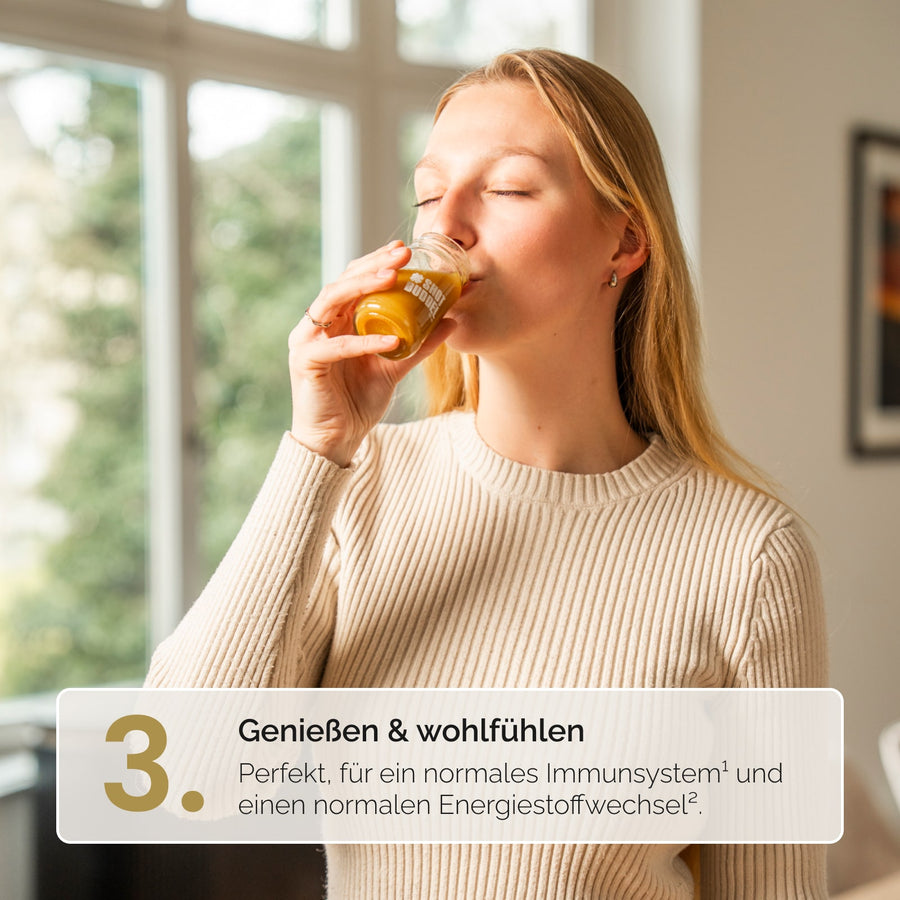 INGWER CLASSIC SHOTS: Frau trinkt den zubereiteten Shot